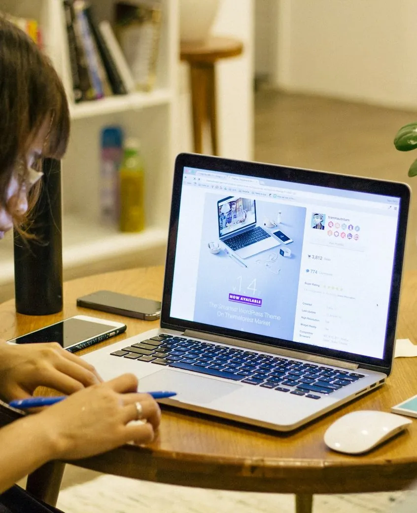 Designer reviewing a website on a laptop