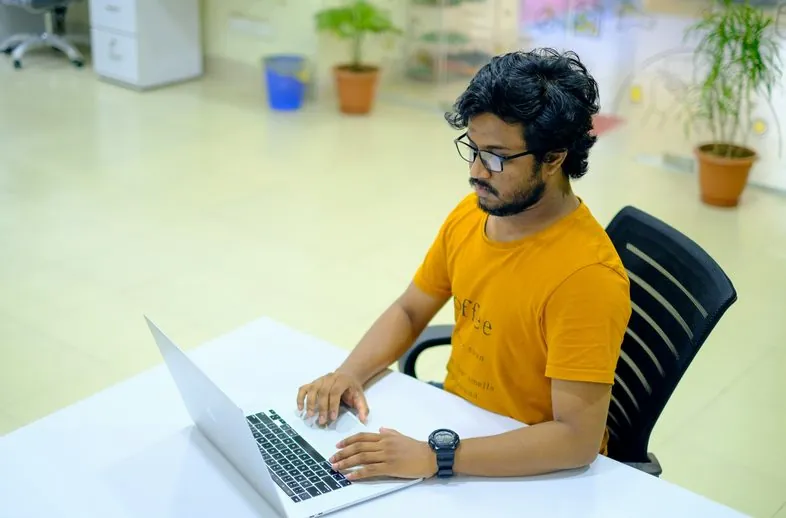 Support specialist working on a laptop