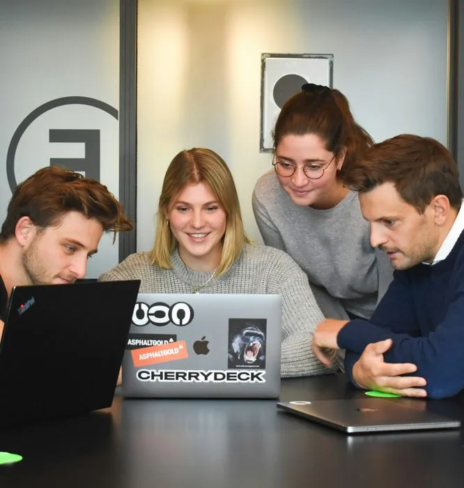 Techno Mantraa team working together on a laptop